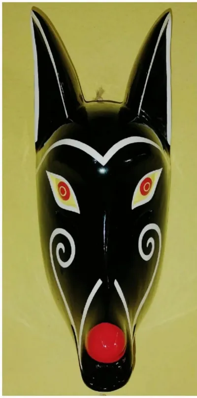 Máscara de coyote negro con espirales blancas en las mejillas, ojos rojos y nariz roja